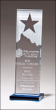 Glass award with star and mountain peak with blue glass base