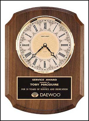 American walnut vertical wall clock with notched edges and ivory dial
