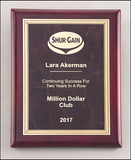 Ruby marble plate with gold florentine border on rosewood piano-finish plaque